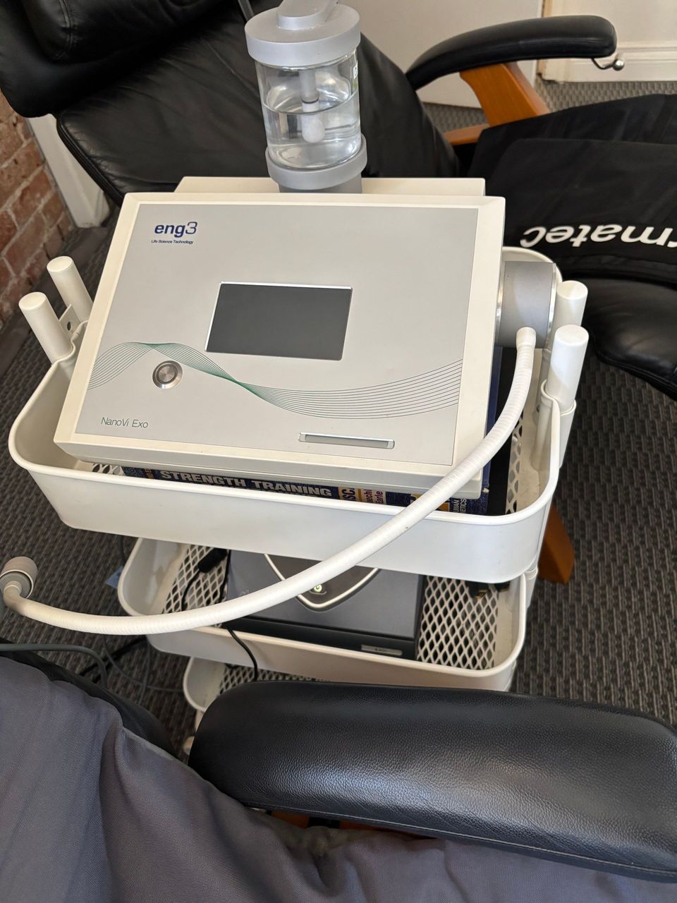 A chair with a pair of compression sleeves on it