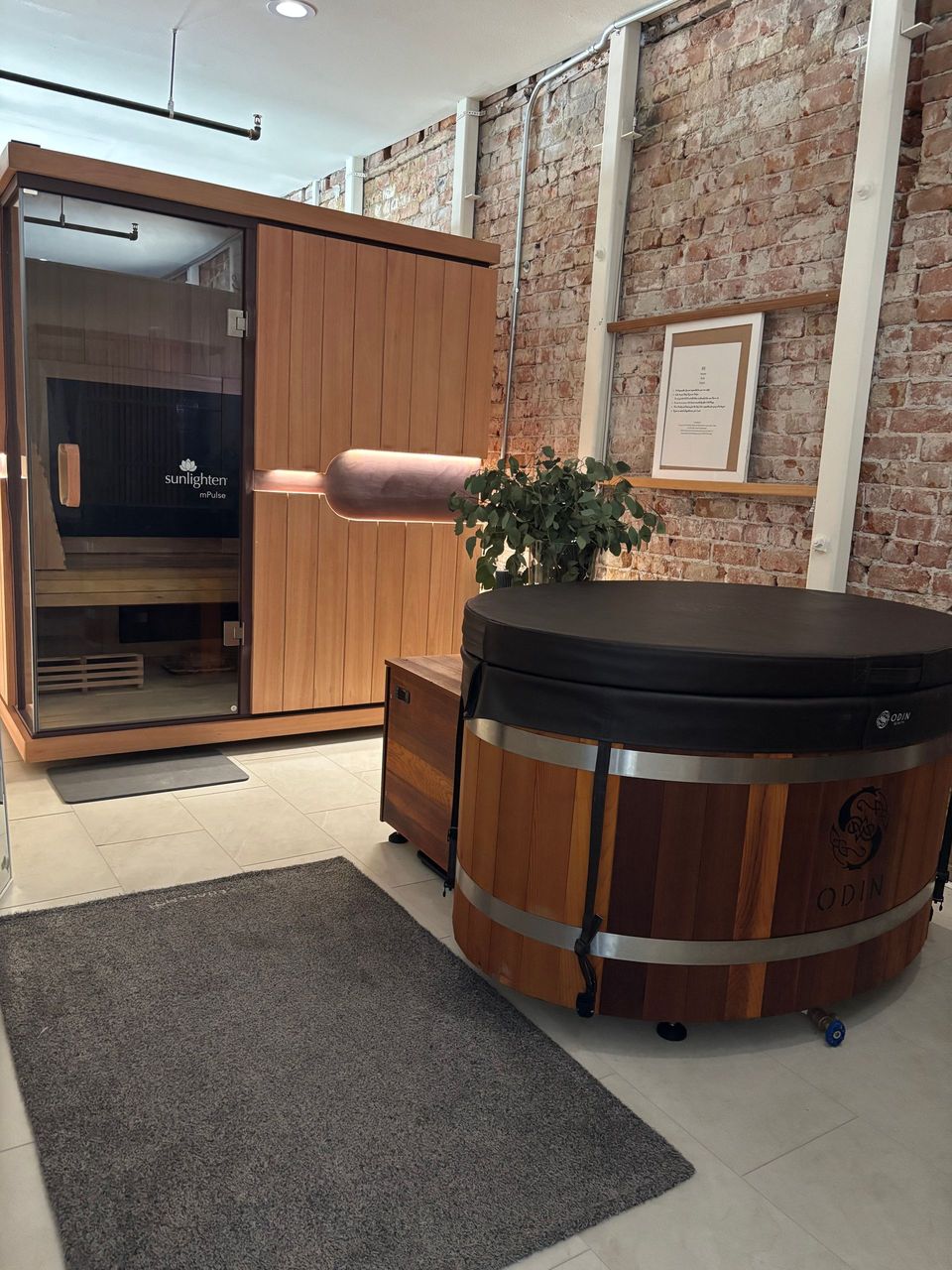 A room with a wooden sauna and a hot tub.