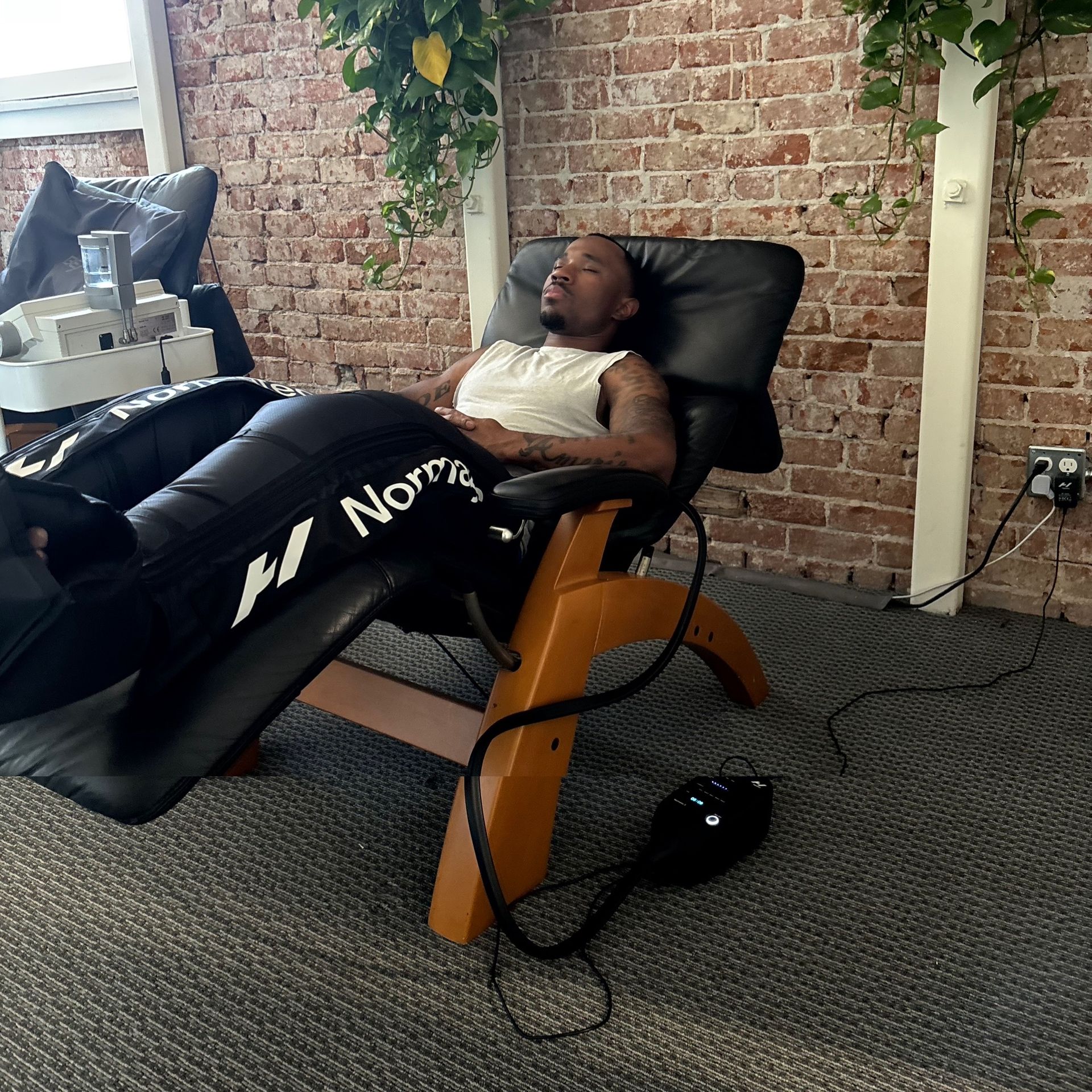 A room with a bed and a chair in it