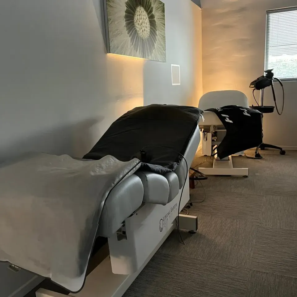 A room with a bed and a chair in it