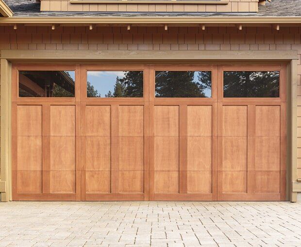 Closed Brown Garage Door With Windows — Garage Door Maintenance in Gold Coast