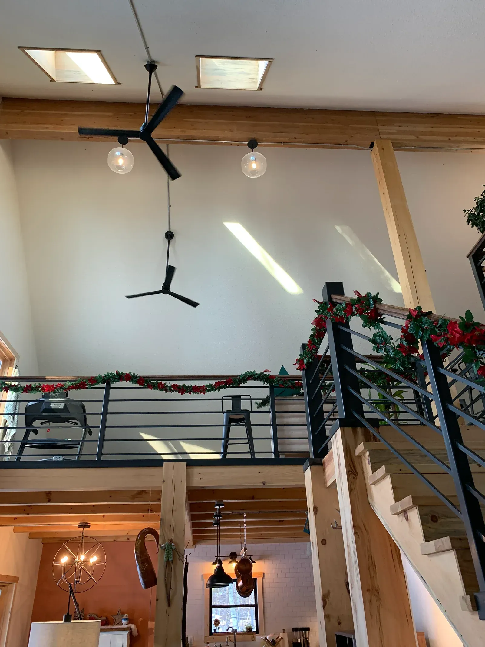 A ceiling fan is hanging from the ceiling of a house.