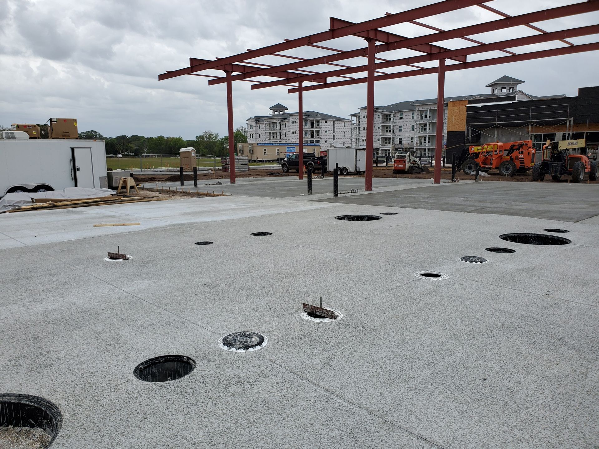 A construction site with a lot of holes in the ground