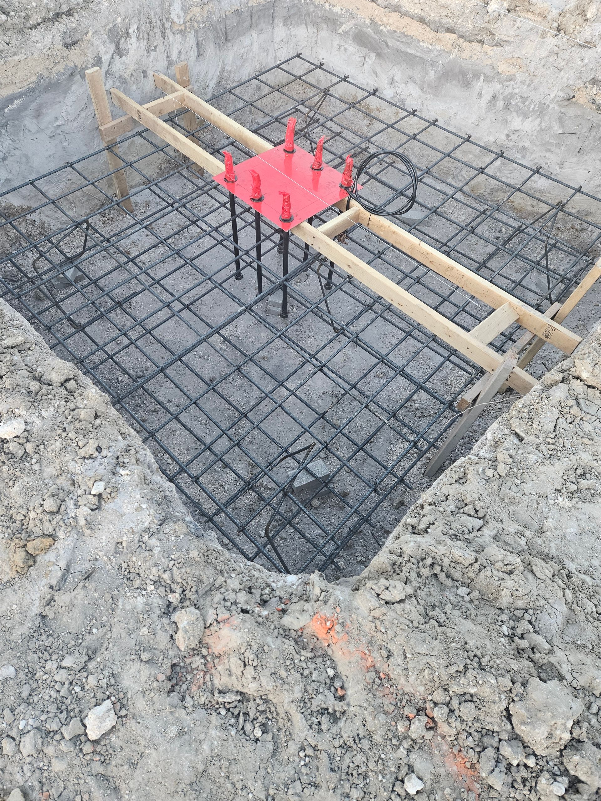 A concrete slab is being built on a construction site.
