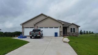 Home renovation — House with White Garage in Muscatine, IA