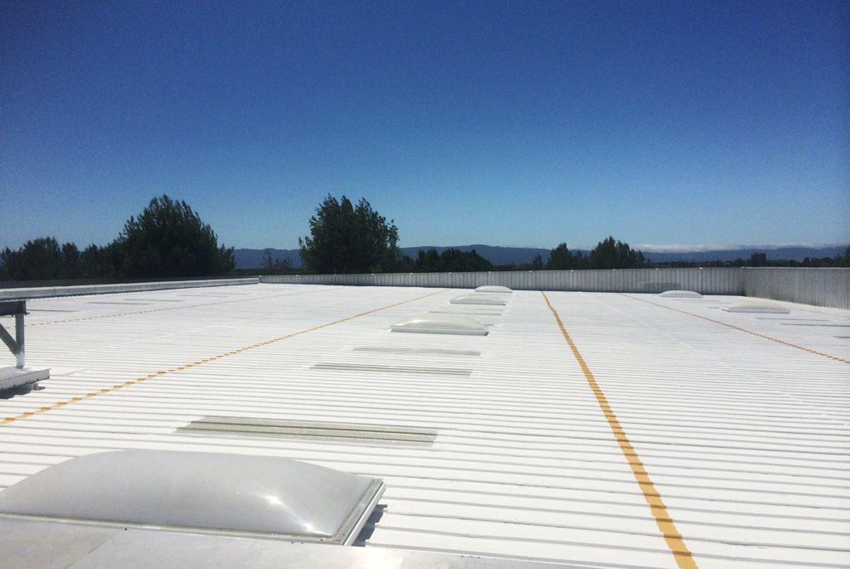 A white roof with a blue sky in the background