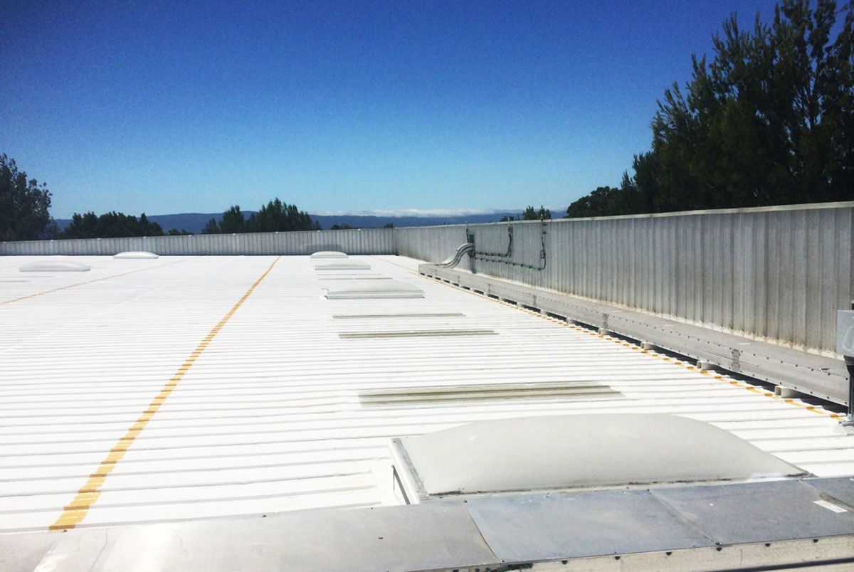 A white roof with a blue sky in the background