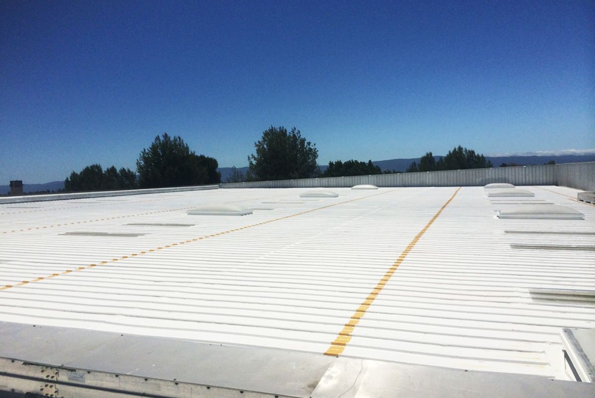 A white roof with a blue sky in the background