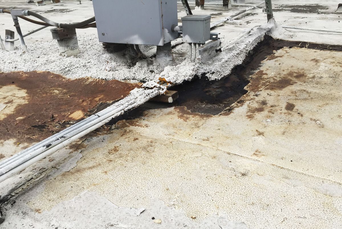 A dirty roof with a box on top of it