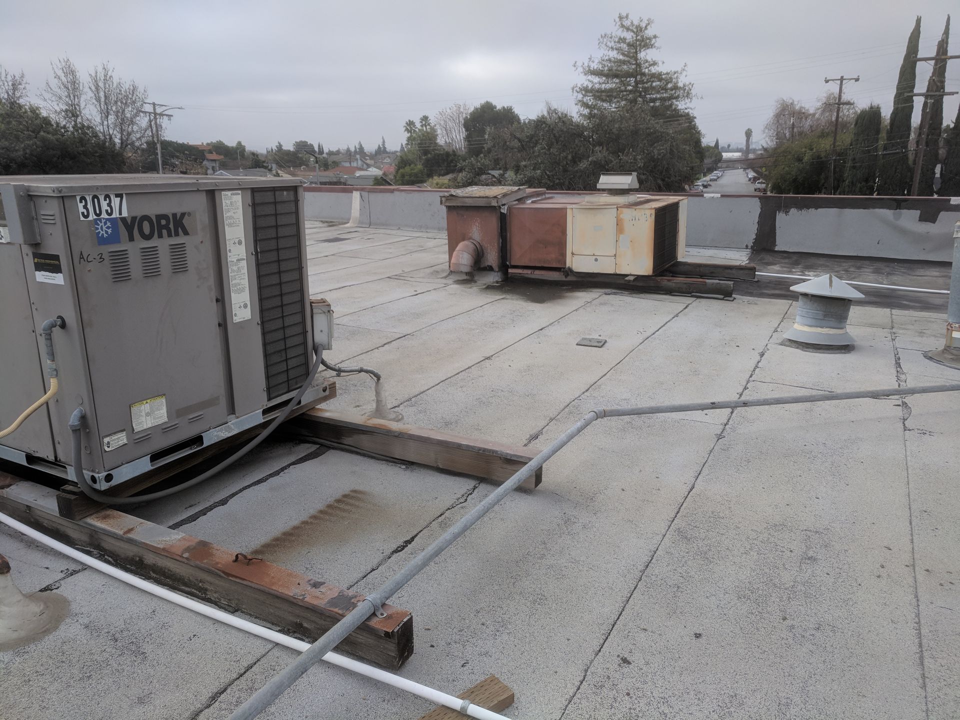 A york air conditioner is sitting on top of a roof