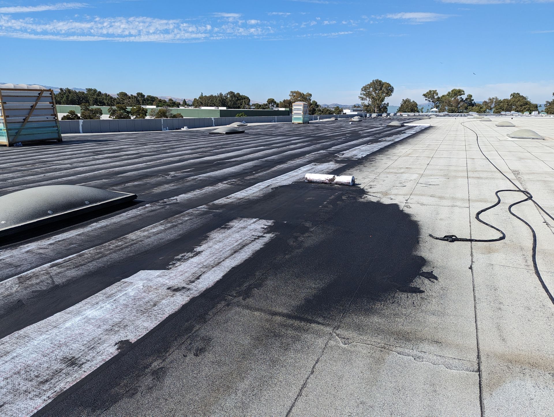 A roof with a shadow of a person on it