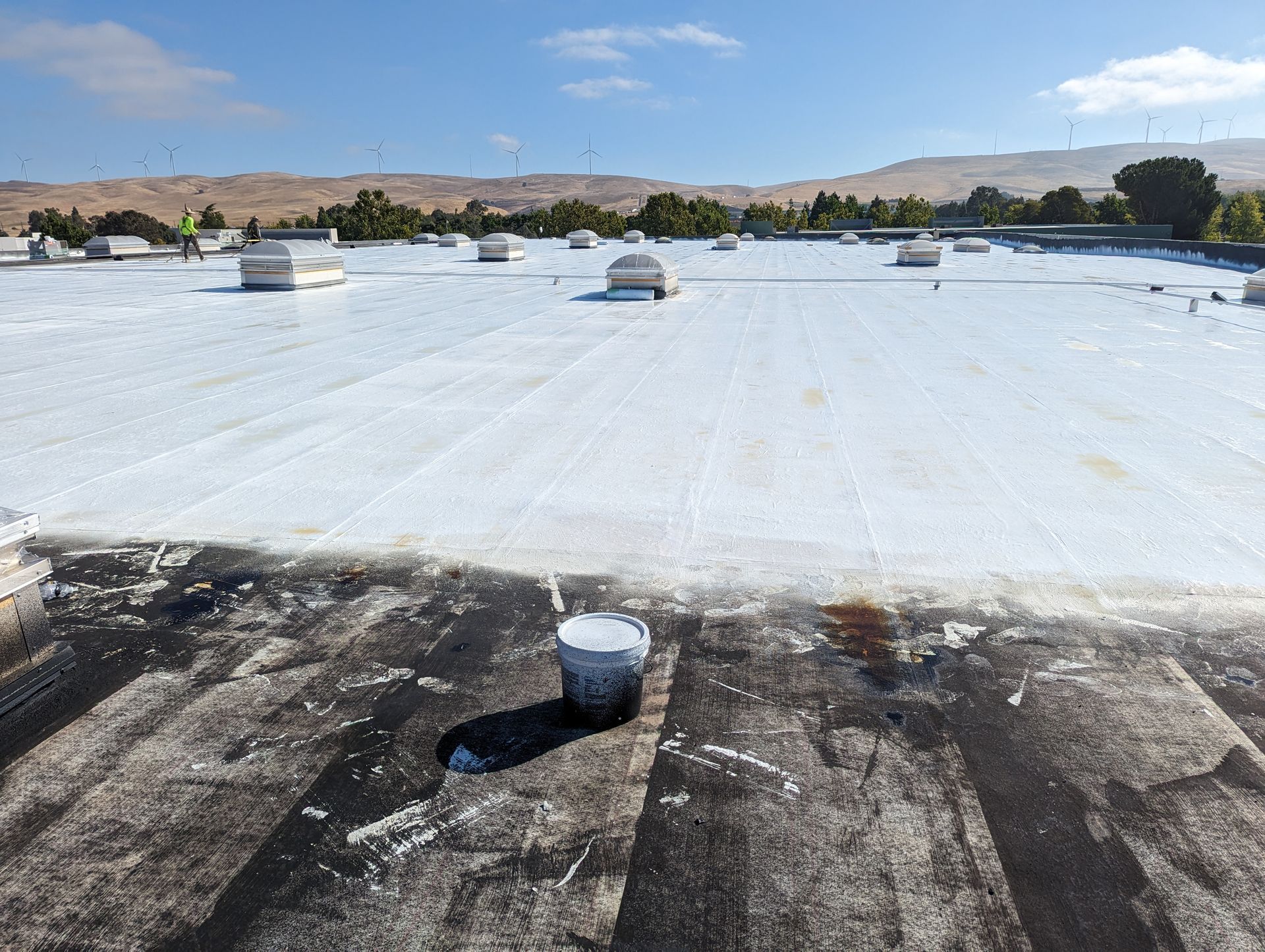 A large white roof with a hole in the middle of it.