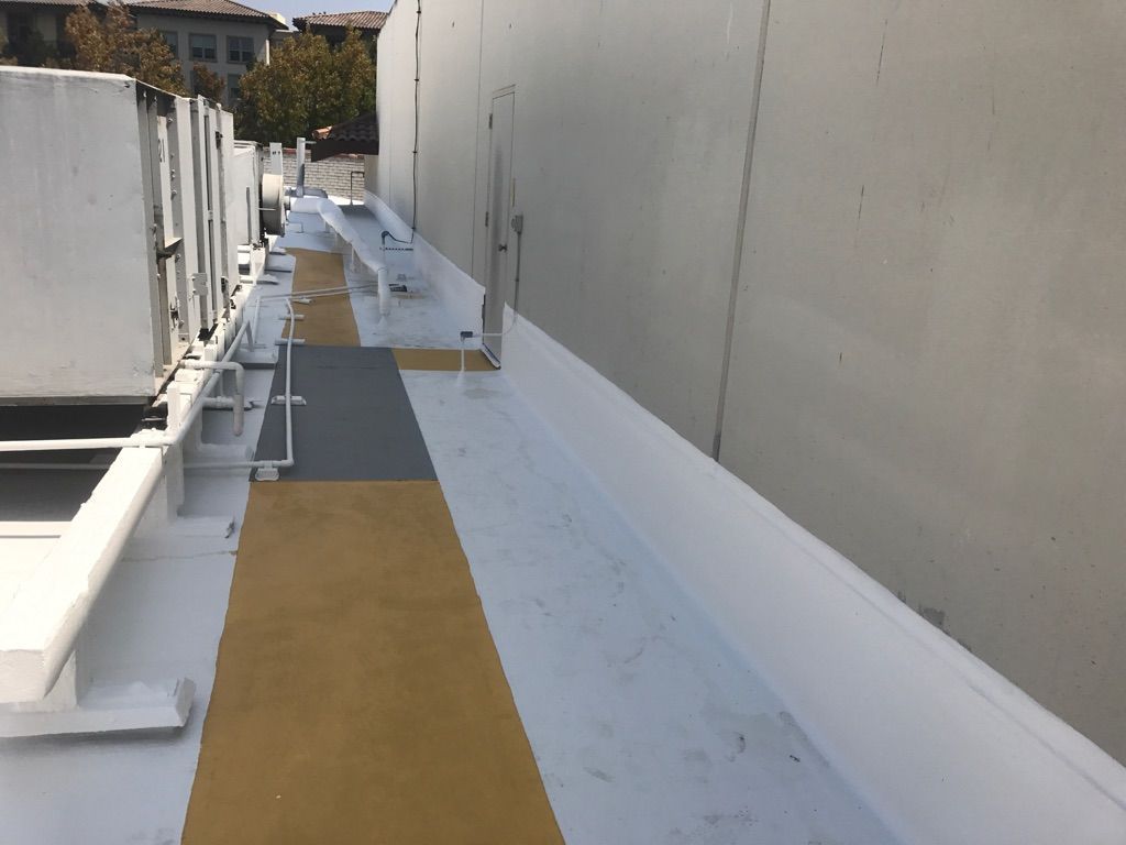 A walkway on the side of a building with a white border