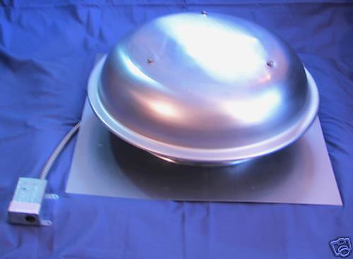 A silver bowl is sitting on top of a blue cloth