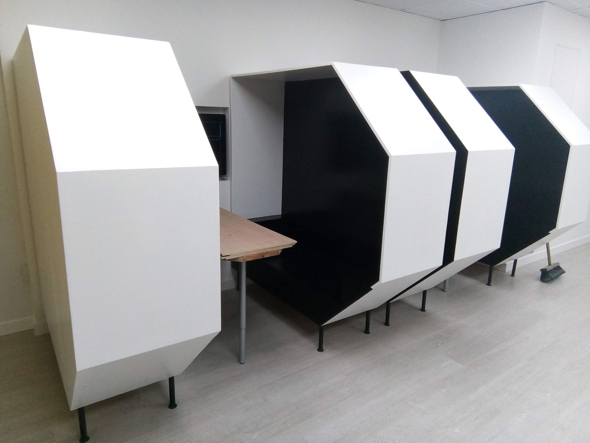 A row of black and white boxes in a room