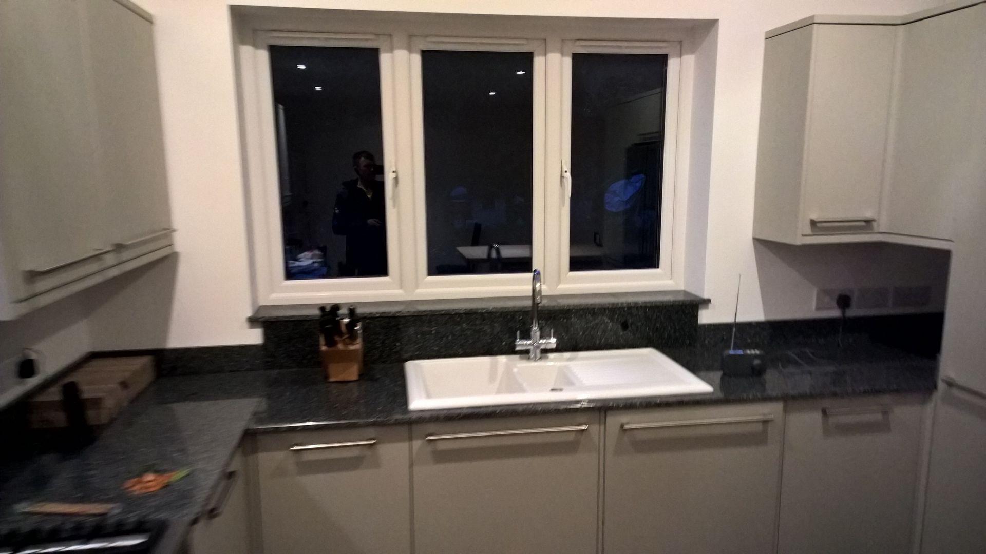 A kitchen with a sink and a window.