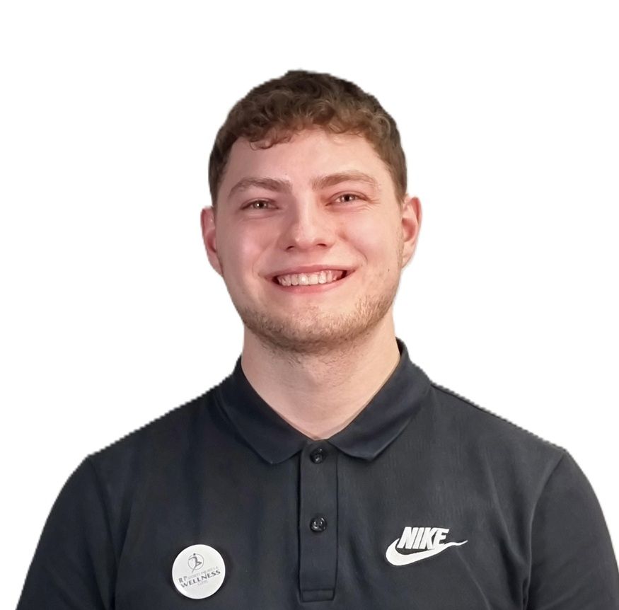 Daniel, a Sports Therapist at Total Massage Clinic, smiles warmly while wearing a black Nike polo shirt with a clinic badge, against a plain white background.