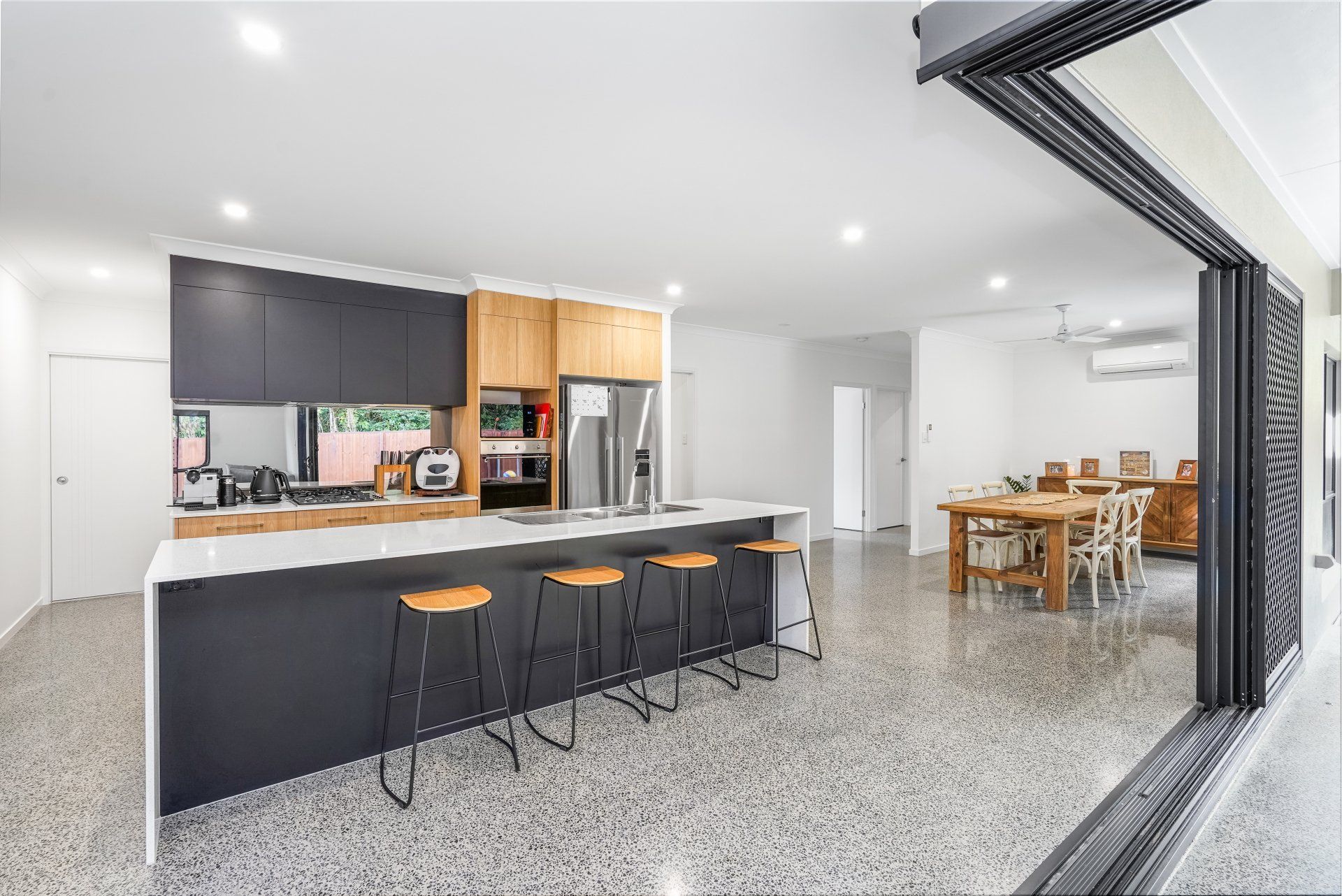 Kitchen Area With White Cabinets — Kitchen Design in Edmonton, QLD