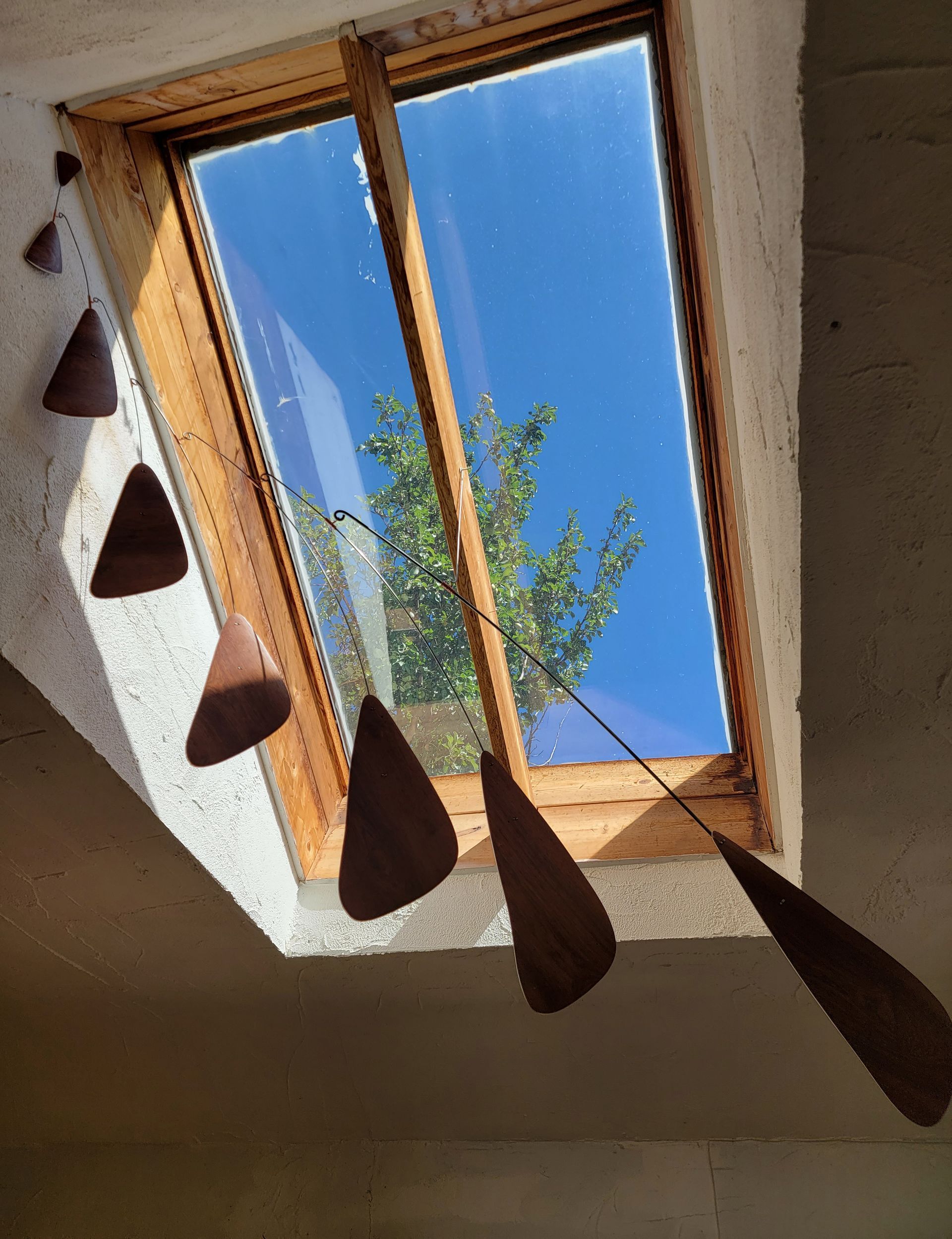 A window with a blue sky behind it