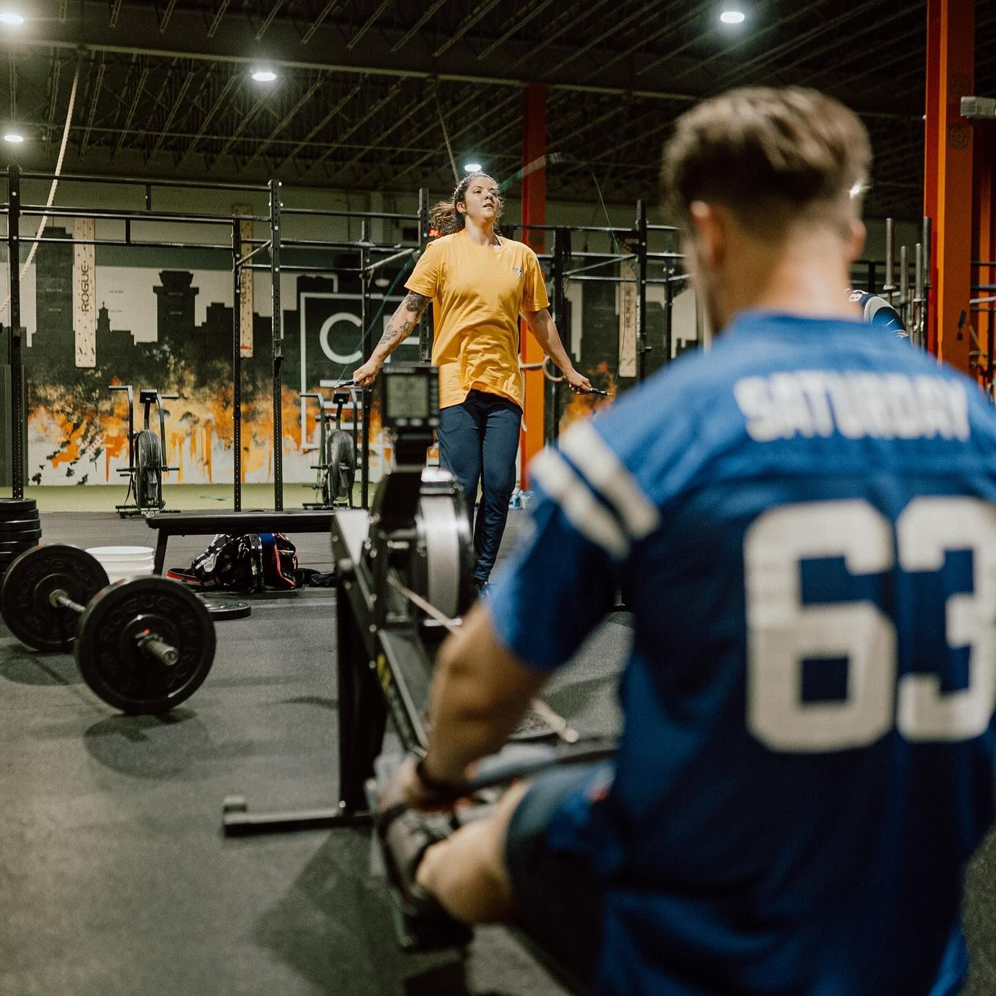 A man in a blue jersey with the number 63 on it