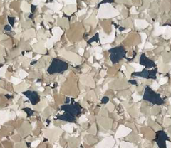 Floor coating with beige, white, dark blue, and tan chips.