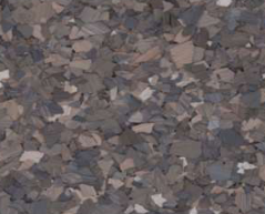 Close-up of a mottled floor with gray, brown, and white chips.