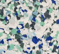 Floor covering with white, blue, and green chips scattered on a white background.