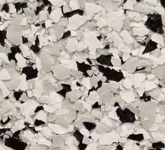 White, black, and gray decorative floor chips, scattered closely together.