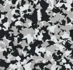 Black, white, and gray epoxy floor with a speckled, flake-like pattern.