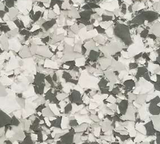 Gray, white, and black decorative floor coating with a speckled, chipped appearance.