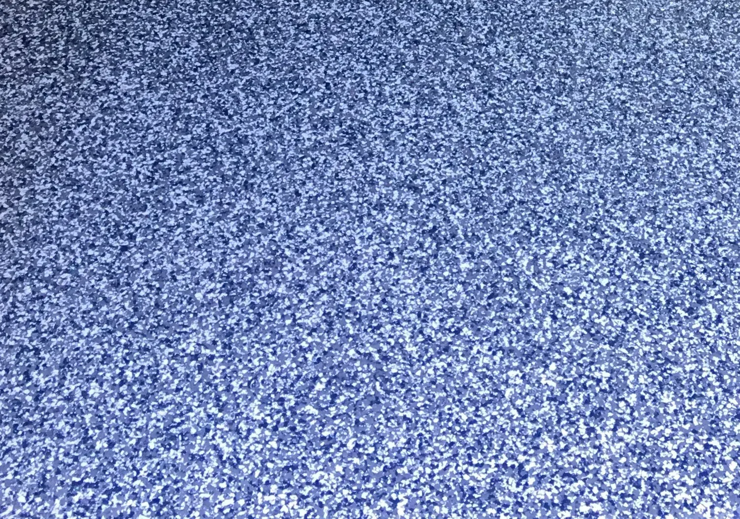 Close-up of small, evenly-distributed, blue gravel.