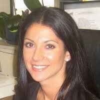 A person icon in a blue circle on a white background.