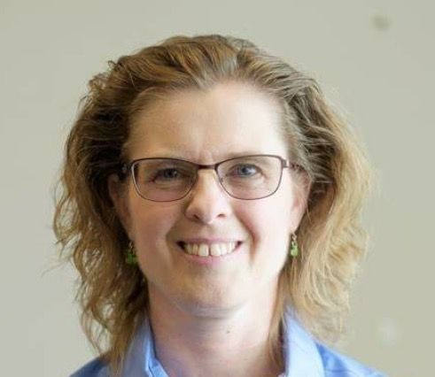 A person icon in a blue circle on a white background.