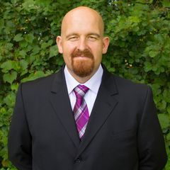 A person icon in a blue circle on a white background.