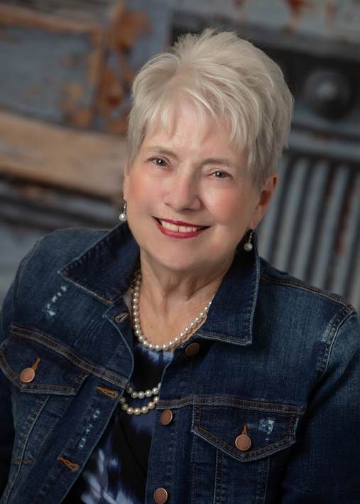 A person icon in a blue circle on a white background.