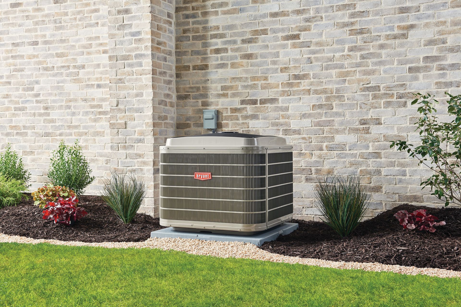 An air conditioner is sitting on the side of a brick building.