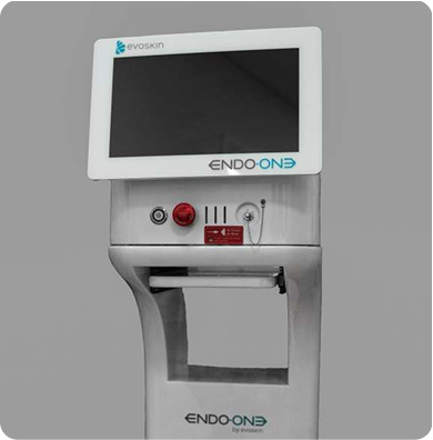 A medical device, held by a person wearing black gloves, touches a person's neck.