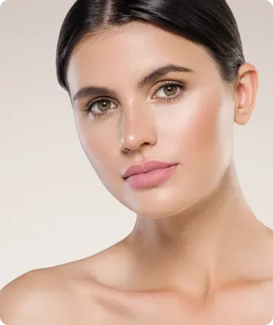 Woman with smooth skin and light makeup, looking towards the camera.