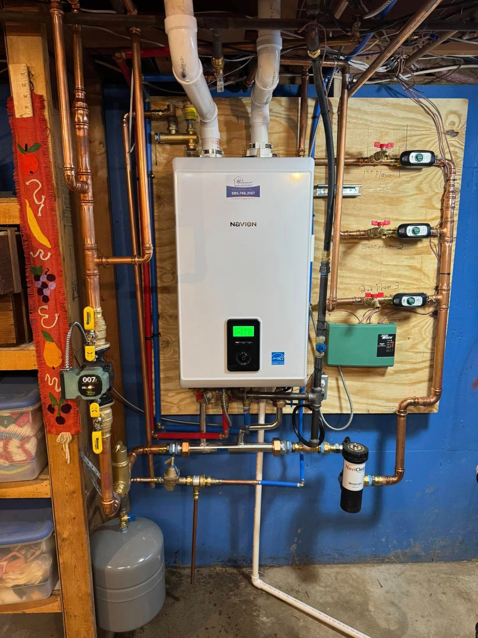A wall-mounted white boiler with copper pipes in a basement setting.