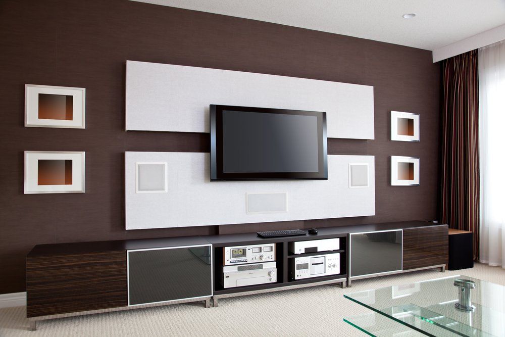 TV Mounted On Wall With Built-in Speakers — Coffs Coast Antenna Services in Coffs Harbour, NSW