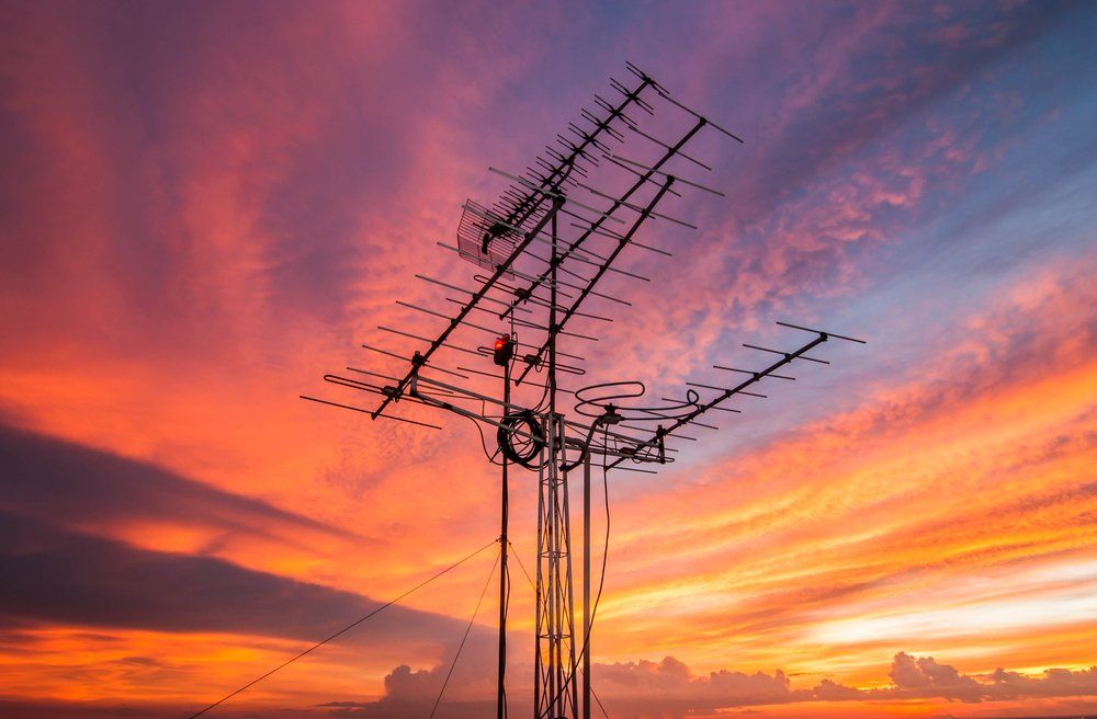 Silhouette of a TV Antenna at Sunset — Coffs Coast Antenna Services in Eungai Creek, NSW