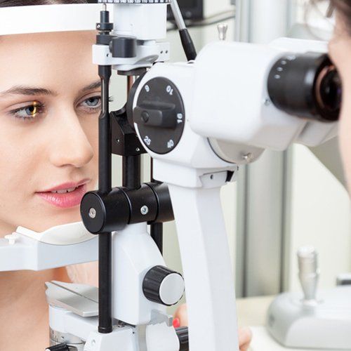 Woman Checking Her Sight at Ophthalmologist — Kenosha, WI — Barnett Wamboldt Eye Care