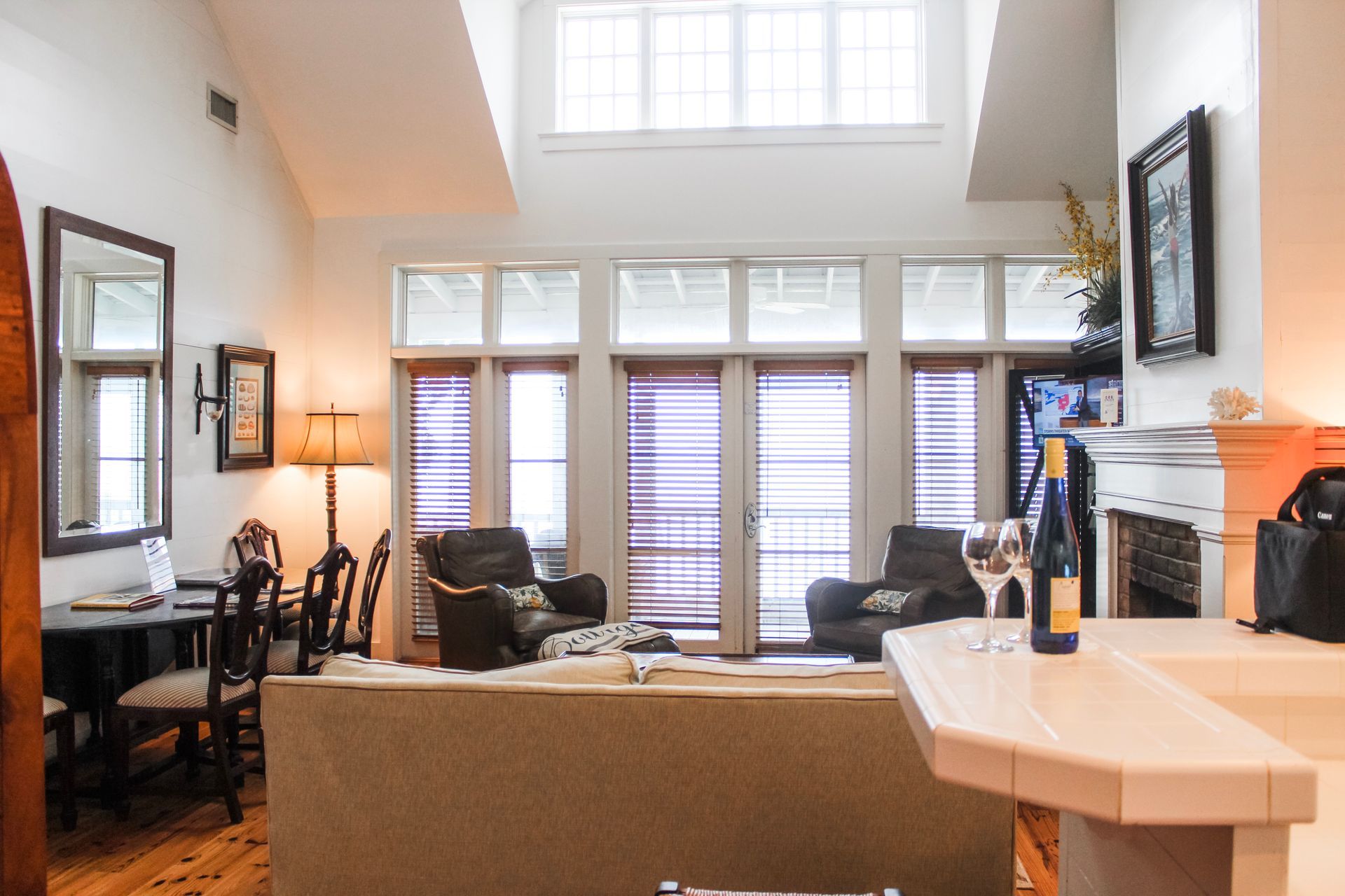 Comfortable living room with French doors leading onto a screened in porch