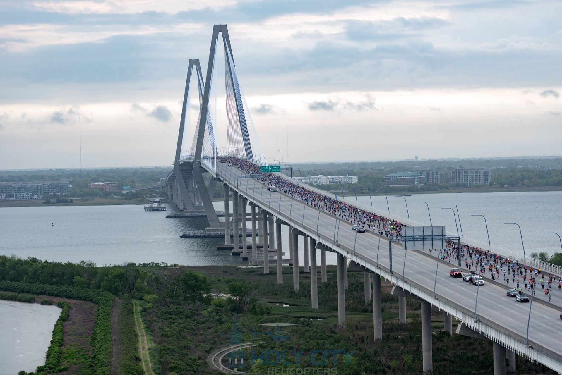 An aerial view of a bridge over a body of water.