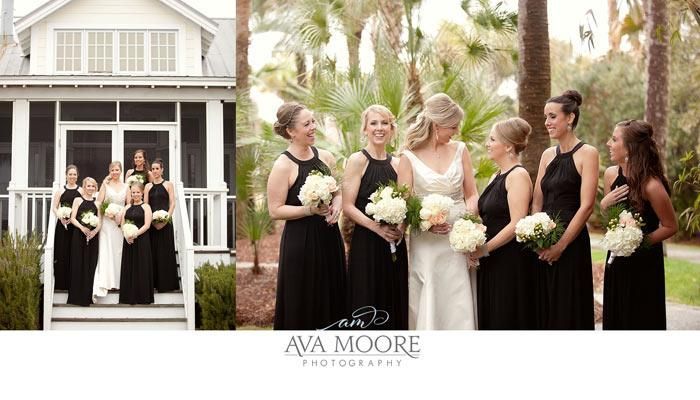 A bride and her bridesmaids are posing for a picture in front of a white house.