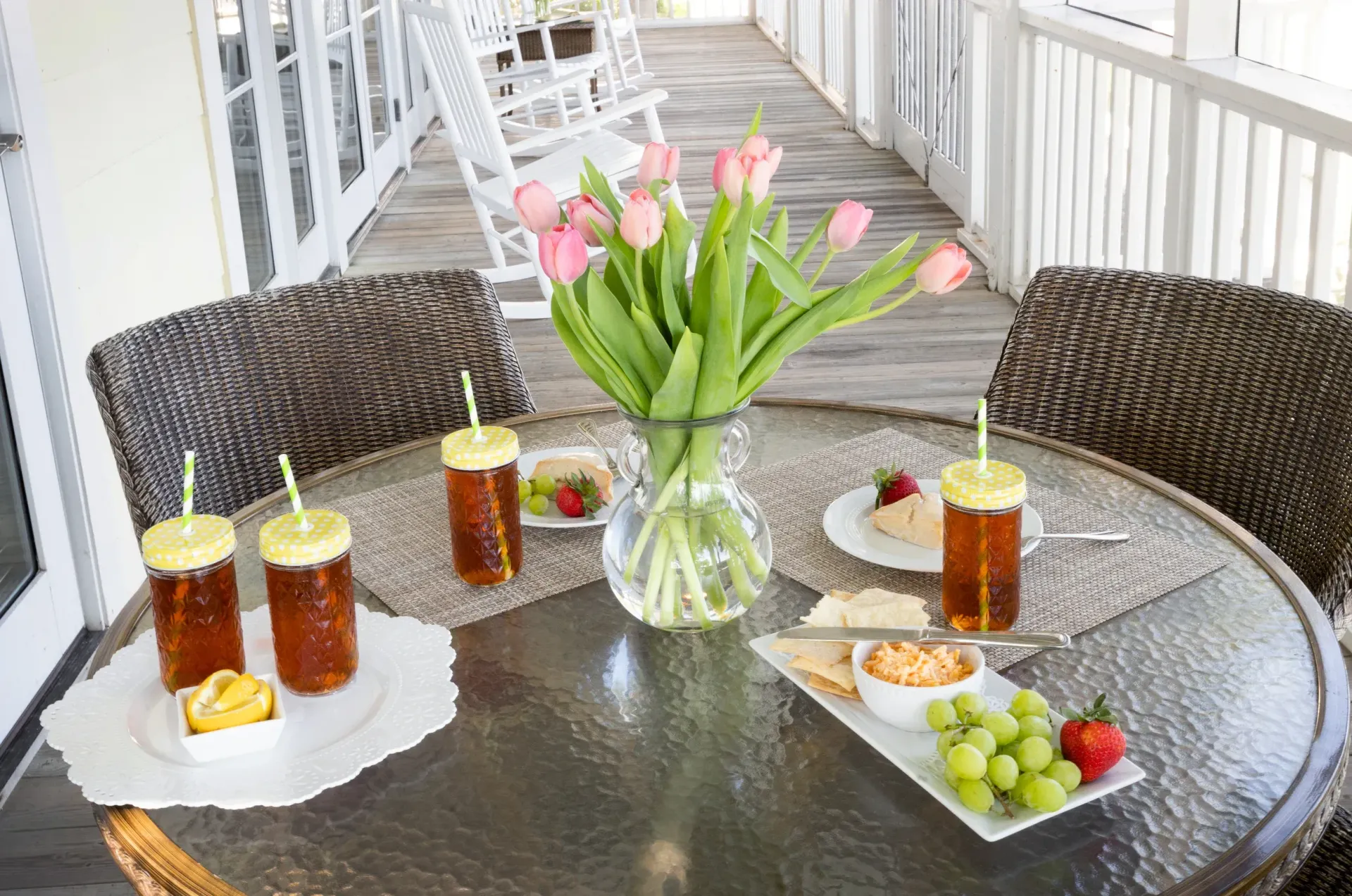 Porch dining table with tea, pimento cheese and fruit tray
