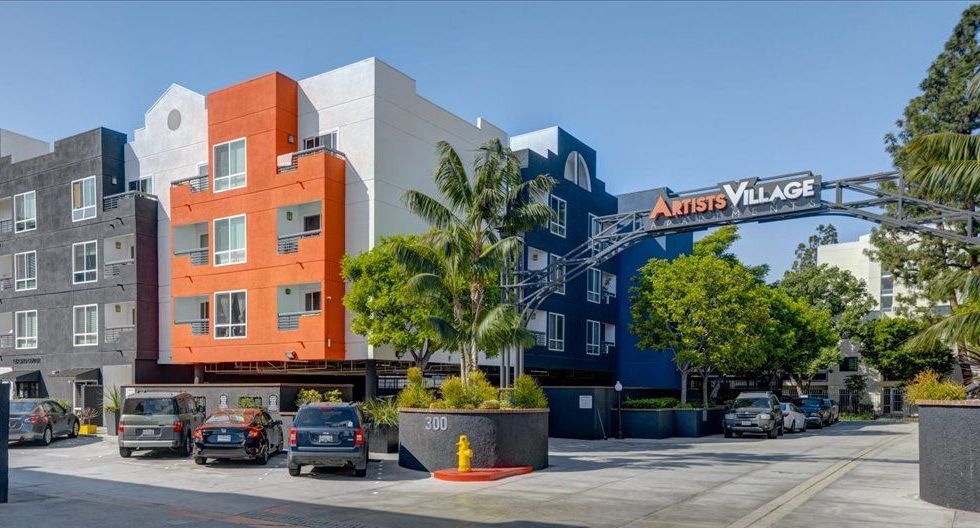 exterior of apartment and welcome sign