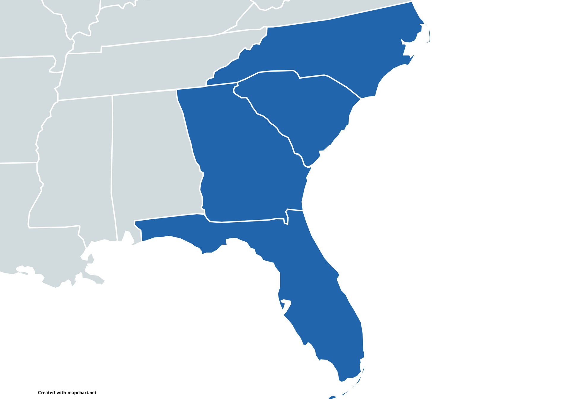 A herd of bison are walking through a grassy field.