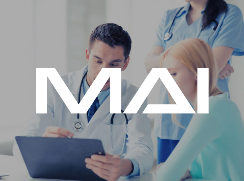 Doctor and patient reviewing medical scan on a tablet; nurse observes.