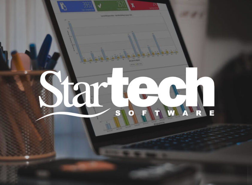 Laptop displaying charts with Startech Software logo overlaid.
